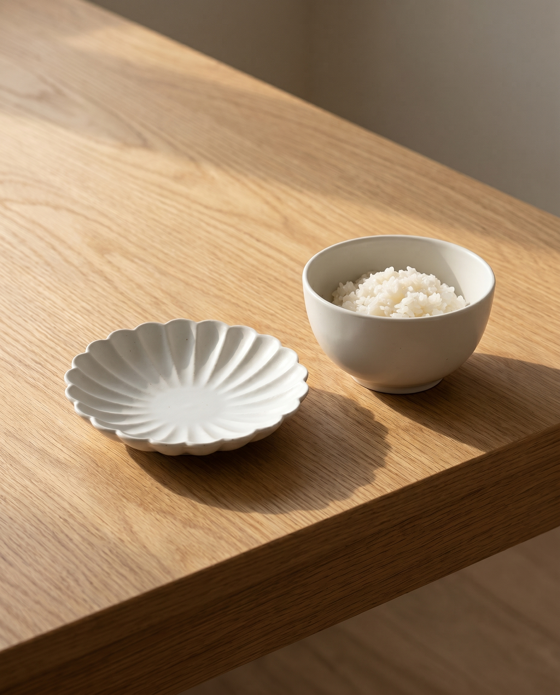 Flower plate set by Mujagi, the chrysanthemum plate beside a small Korean rice bowl for scale