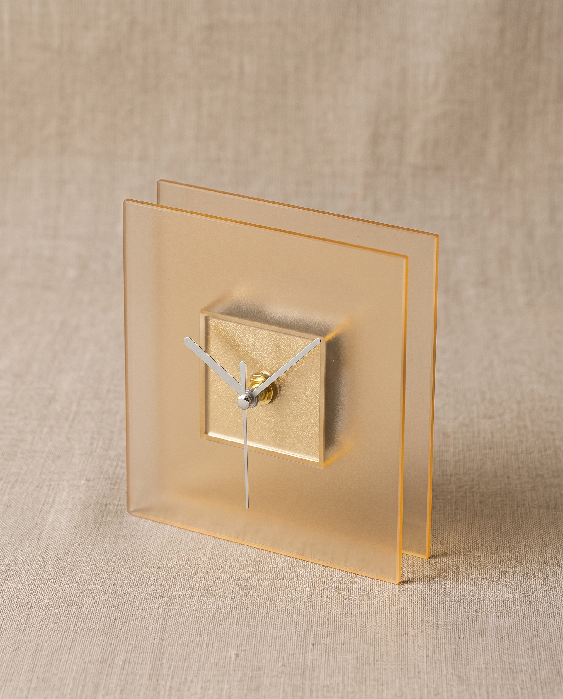 Block clock by APTONE in frosted yellow, three-quarter view on natural linen