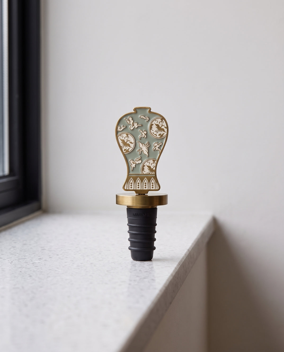 Celadon in the house wine stopper by Mimidar, the celadon design on a terrazzo ledge