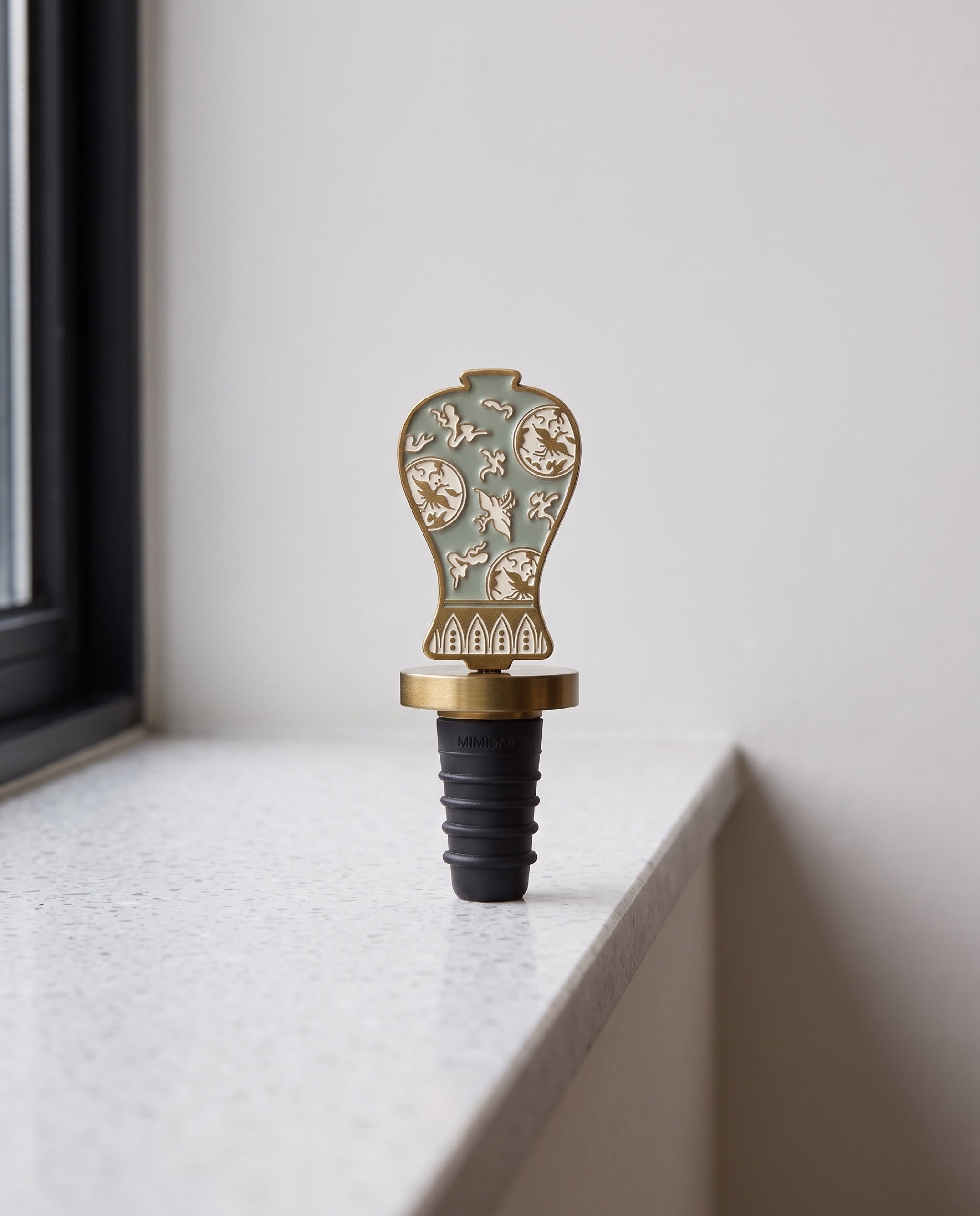 Celadon in the house wine stopper by Mimidar, the celadon design on a terrazzo ledge