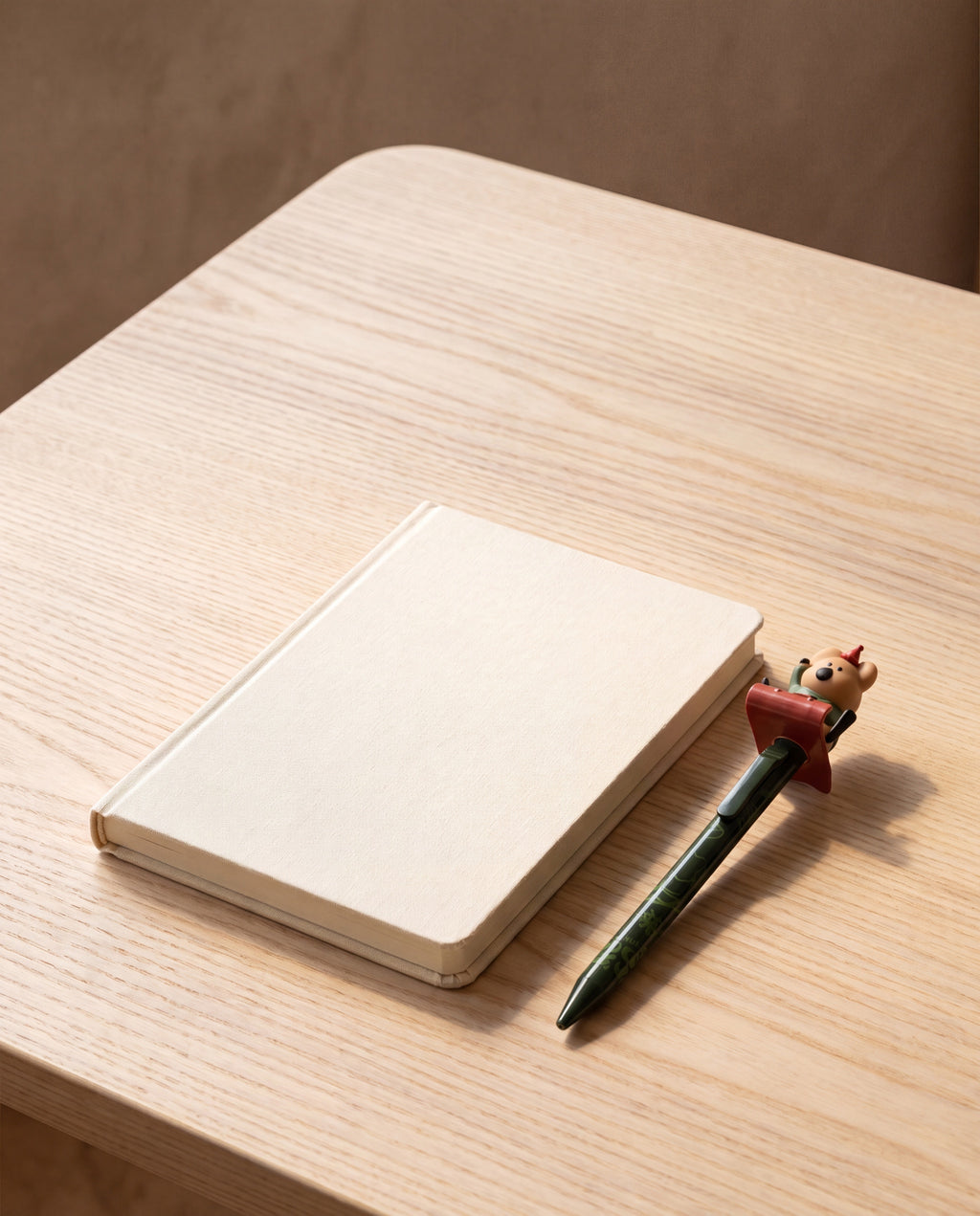 Cococup clicky pen by Dinotaeng, shown beside an A6 notebook for scale