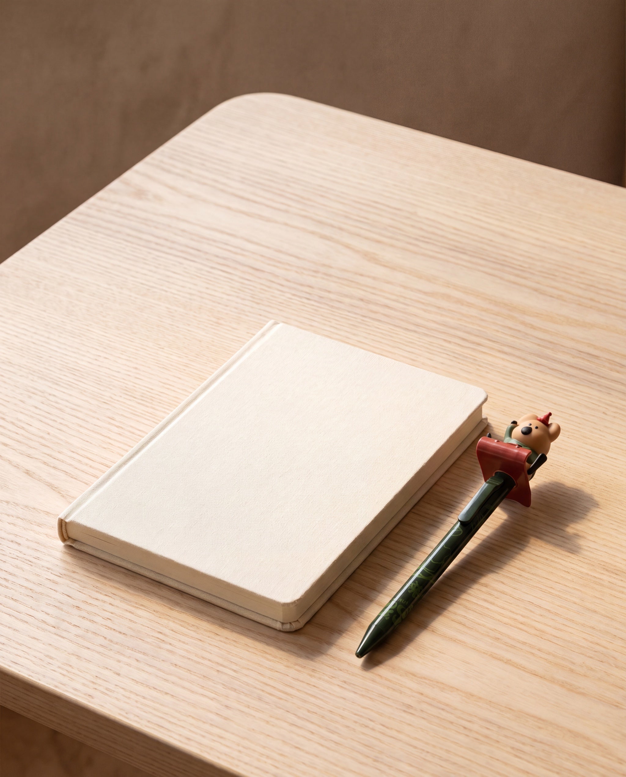 Cococup clicky pen by Dinotaeng, shown beside an A6 notebook for scale