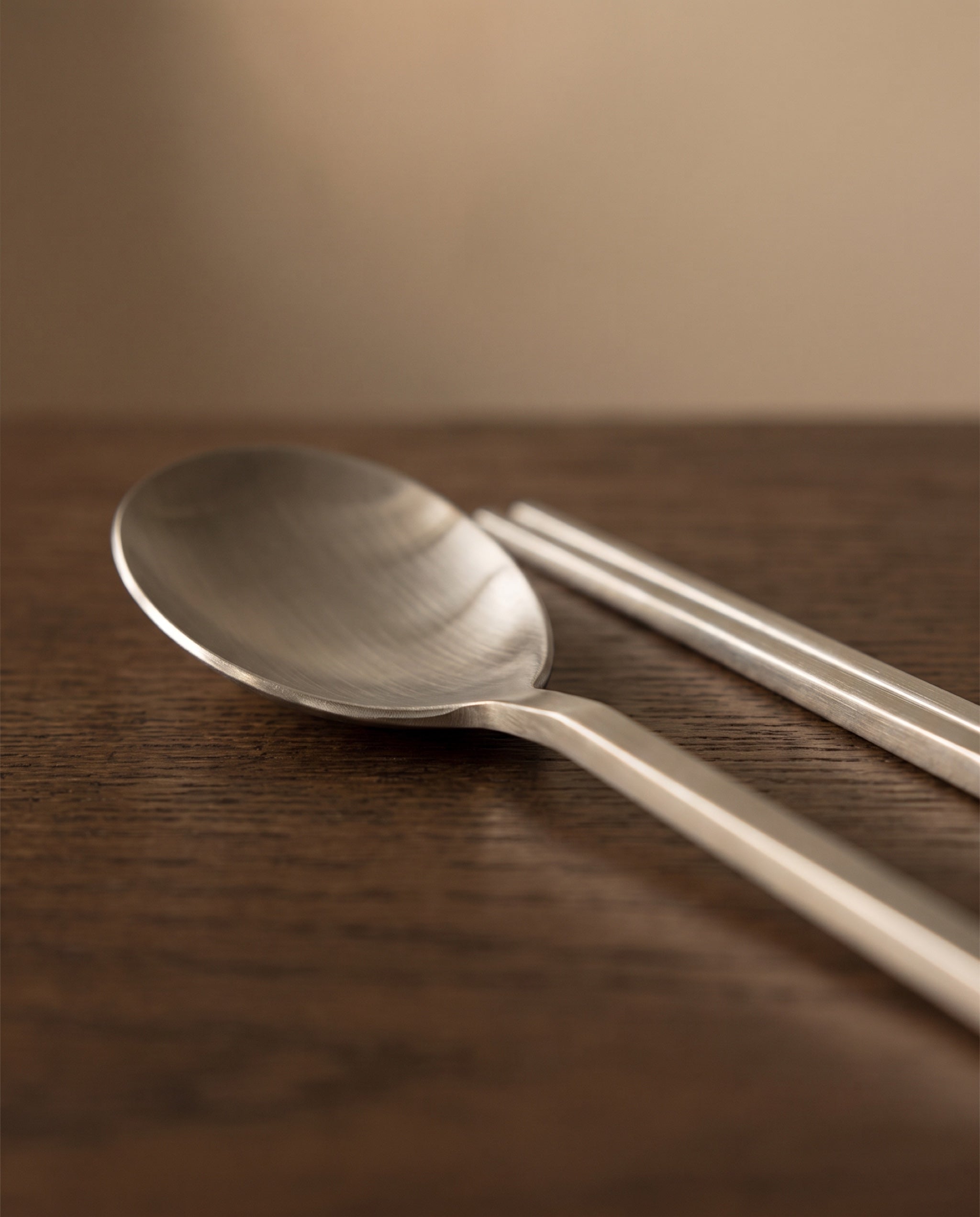 Essential dinner cutlery by NR Ceramics, material detail of the brushed bowl and neck bevel