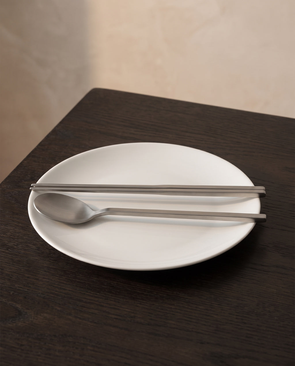 Essential dinner cutlery by NR Ceramics, scale reference across a 26cm dinner plate