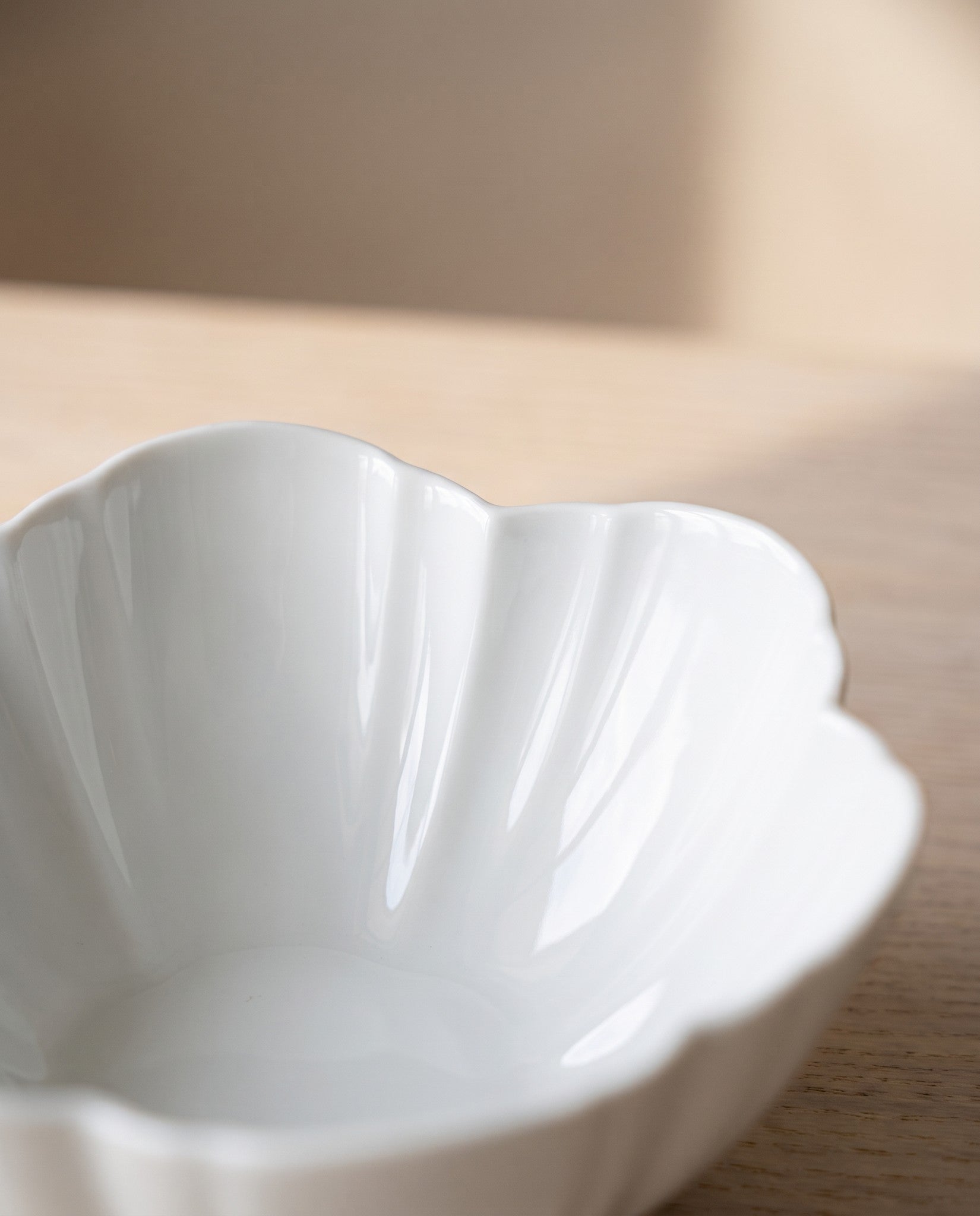 Close-up of the six-petal rim and fluting on the Flower 06 round bowl
