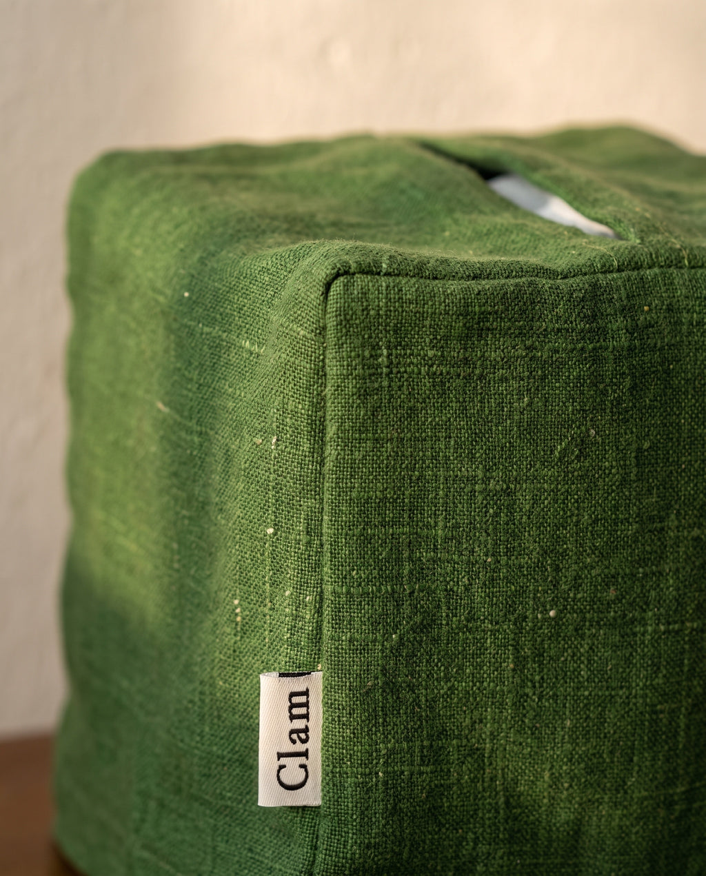 Linen tissue cover by Clam, material detail of the slub weave and the seamed top slit