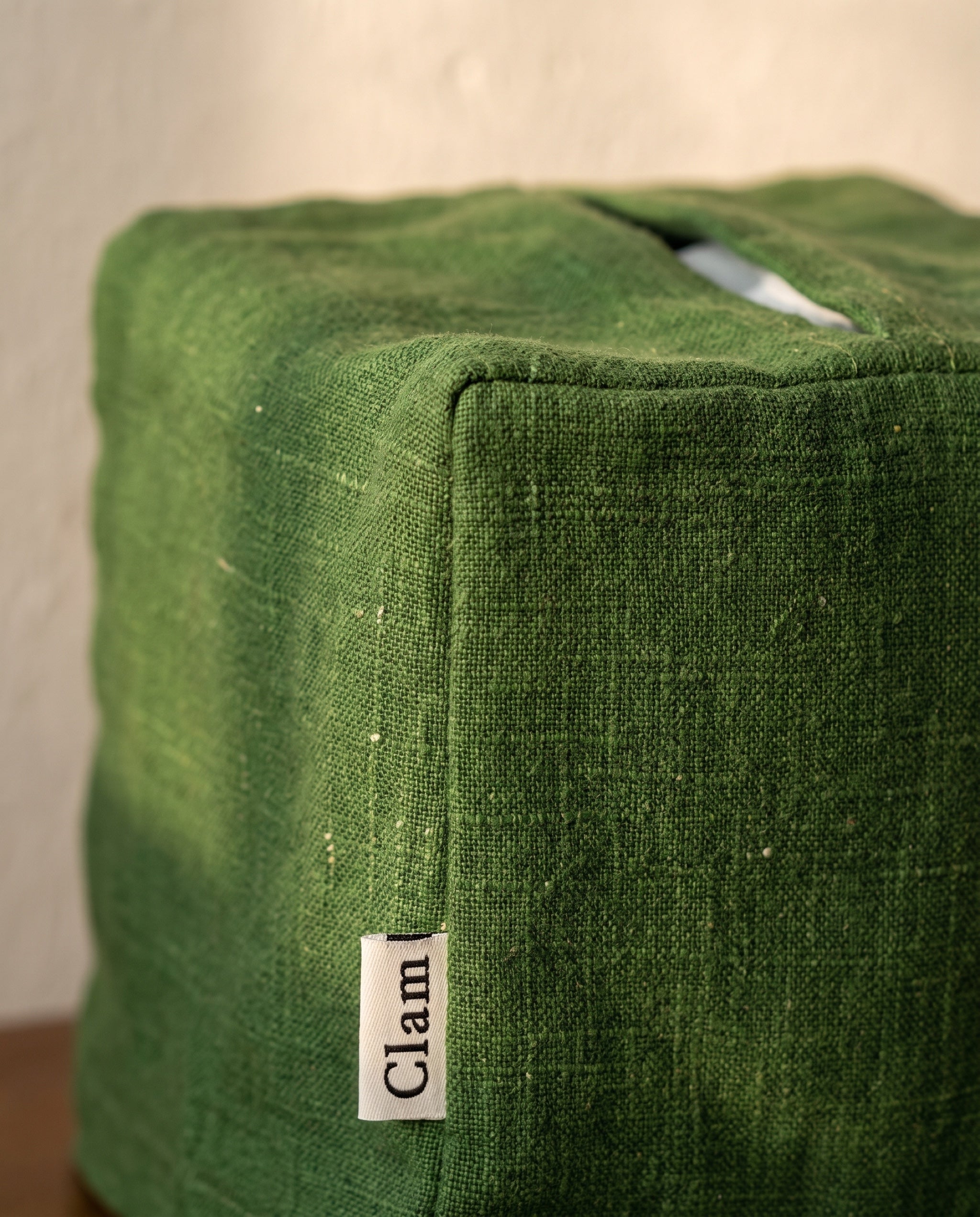 Linen tissue cover by Clam, material detail of the slub weave and the seamed top slit