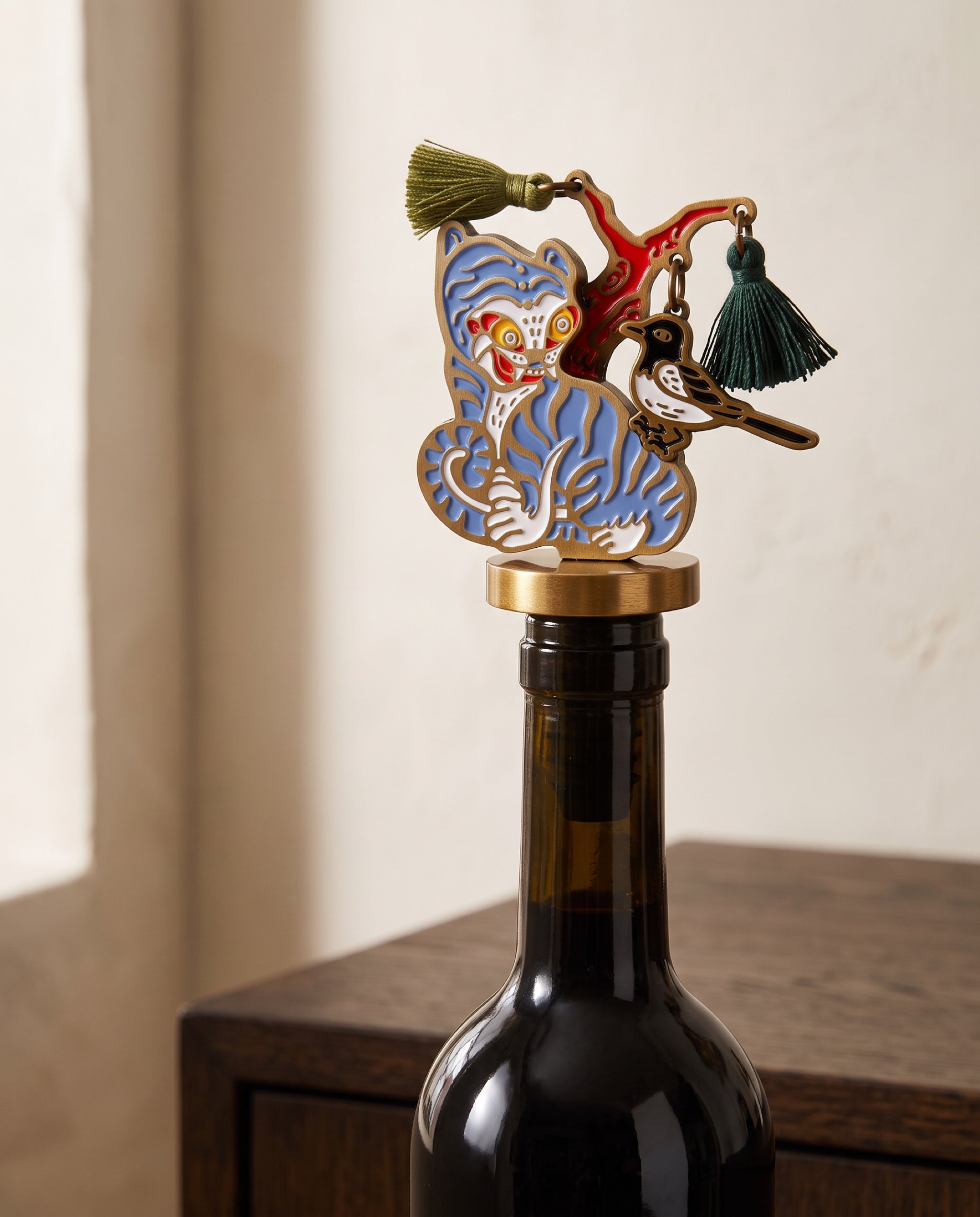 Magpie and tiger wine stopper by Mimidar, the Blue Tiger seated in an opened bottle