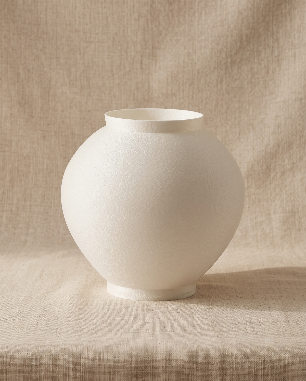 Moonjar & baekja by seasoning objet, the ivory moon jar in 3D-printed PLA, on linen