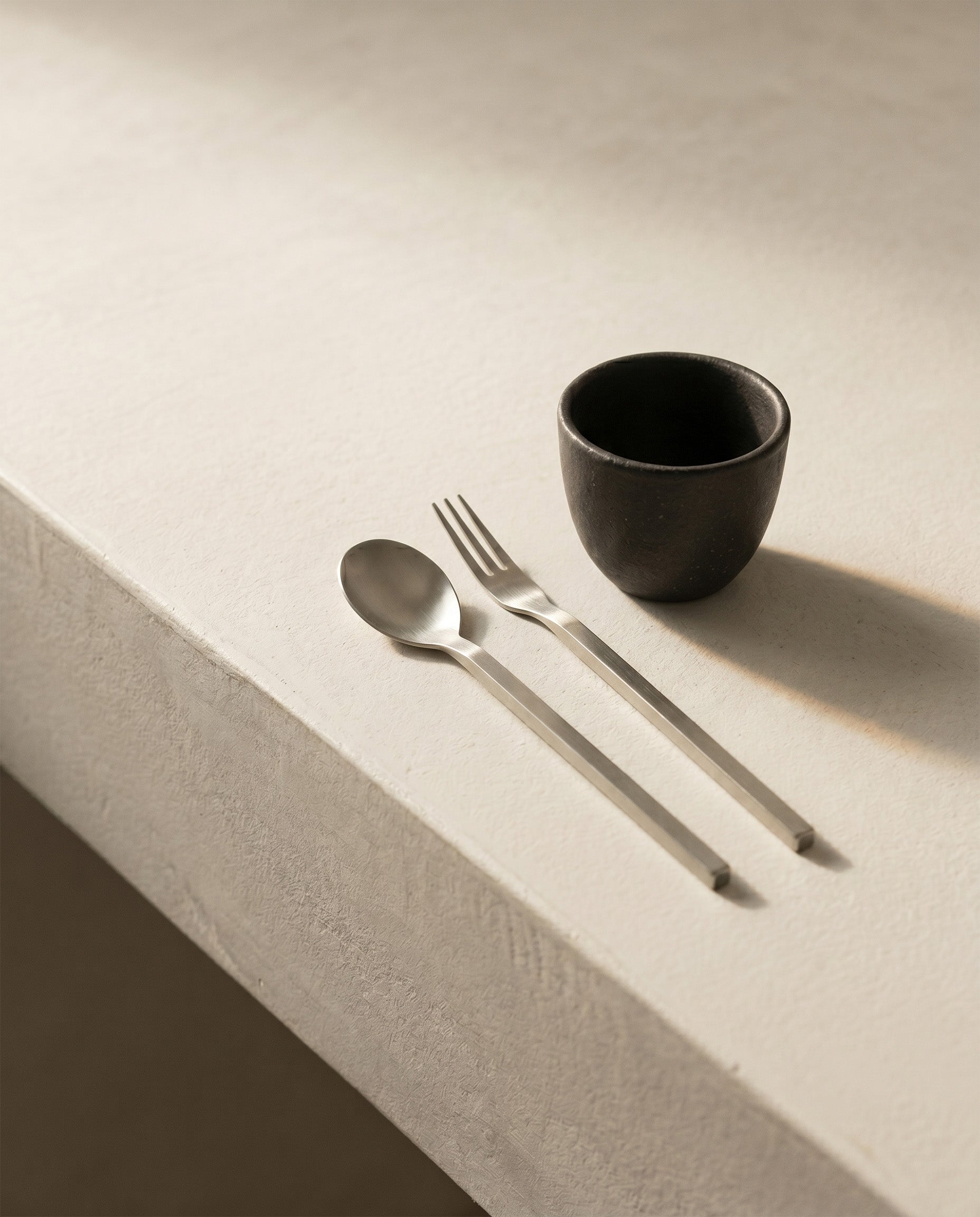 Tea spoon and fork in stainless steel