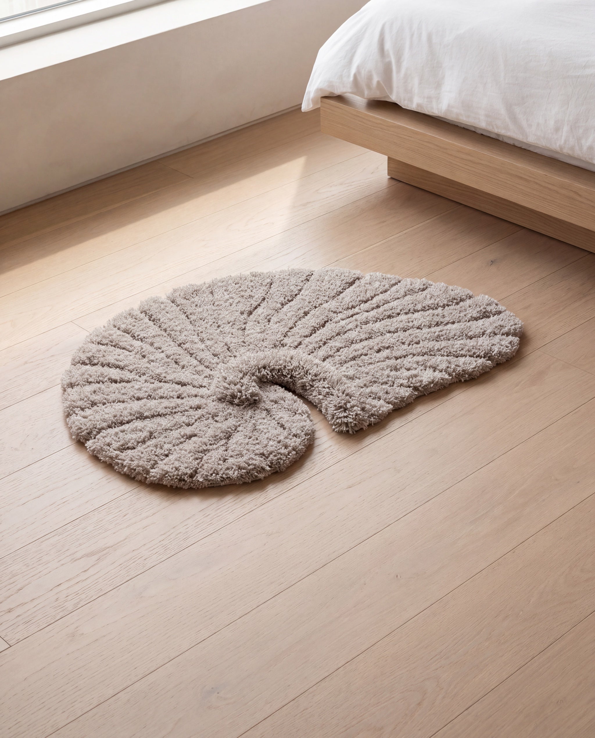Poh object rug by Lug Lug, the gray colorway on pale oak floorboards