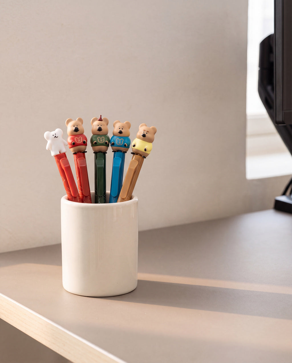 Quokka in School figure pen by Dinotaeng, the set standing in a pen cup on a home desk