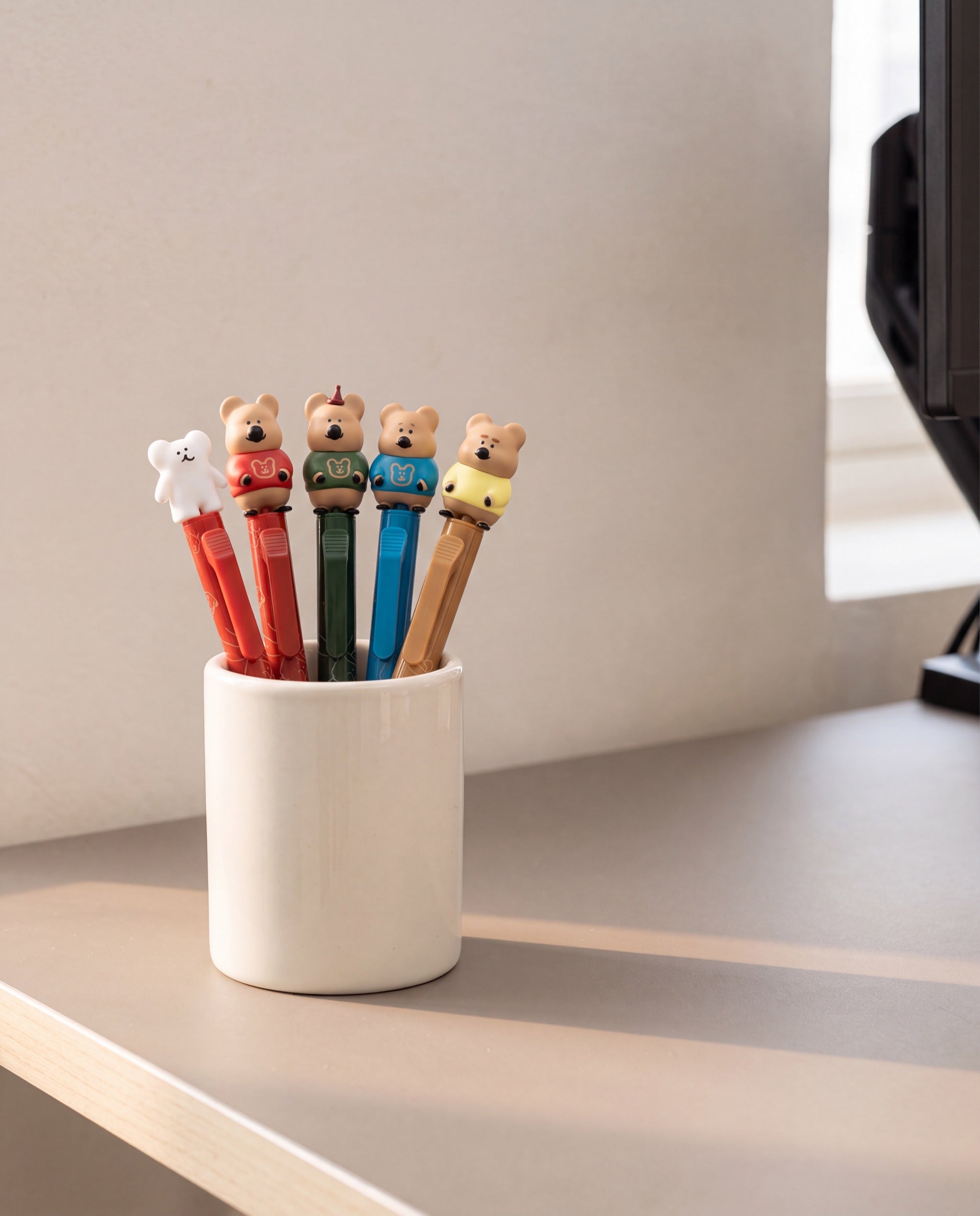 Quokka in School figure pen by Dinotaeng, the set standing in a pen cup on a home desk