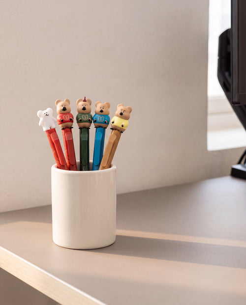 Quokka in School figure pen by Dinotaeng, the set standing in a pen cup on a home desk