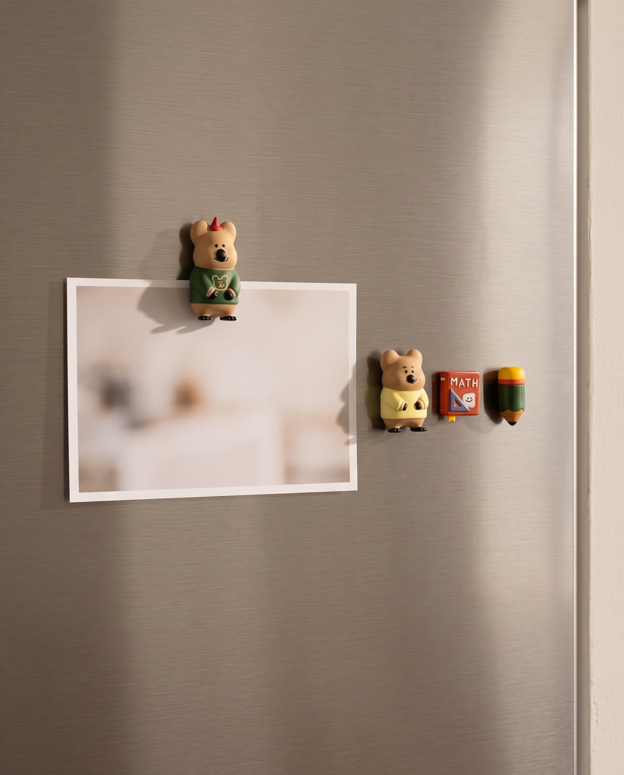 Quokka in School magnet by Dinotaeng, scale next to a 4 by 6 inch photo print