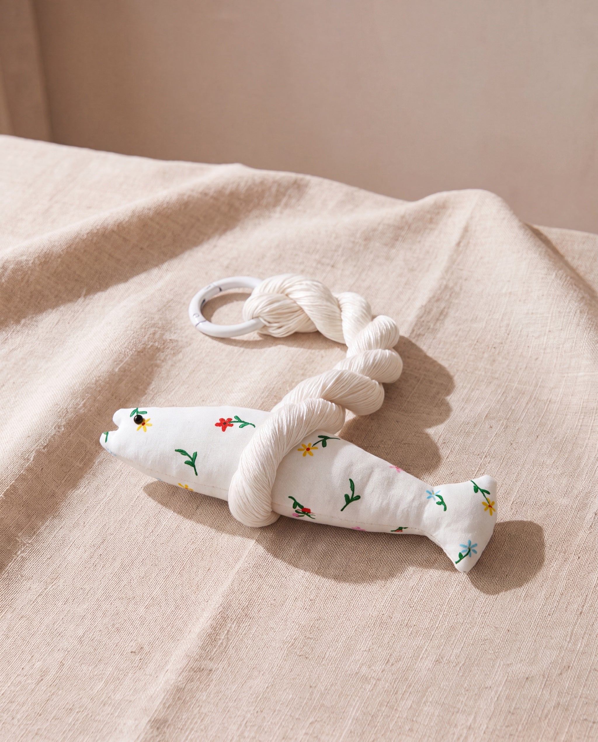 Roa good luck pollack by lemonbaseball livingclub, printed cotton fish with a twisted silk cord, on beige linen