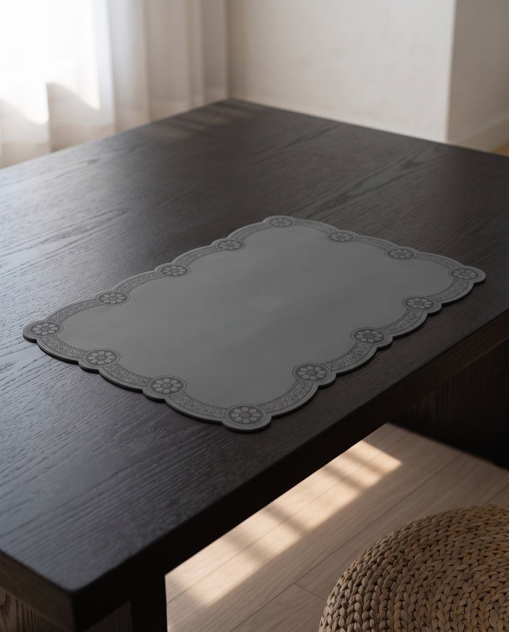Roof tile silicone table mat by Mimidar, on a low dining table in dark-stained ash