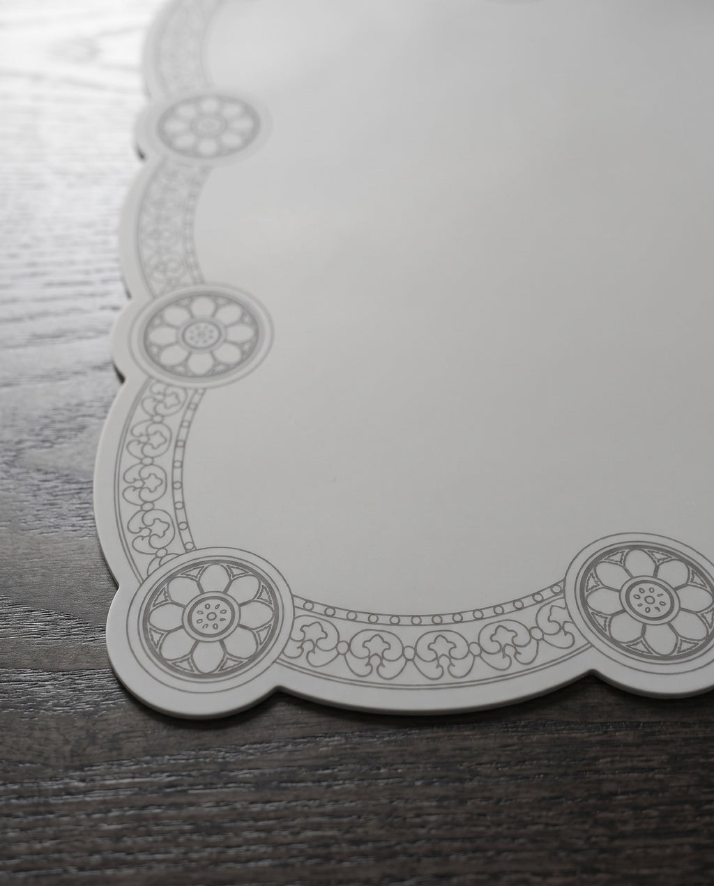 Roof tile silicone table mat by Mimidar, the sumaksae medallion and vine border
