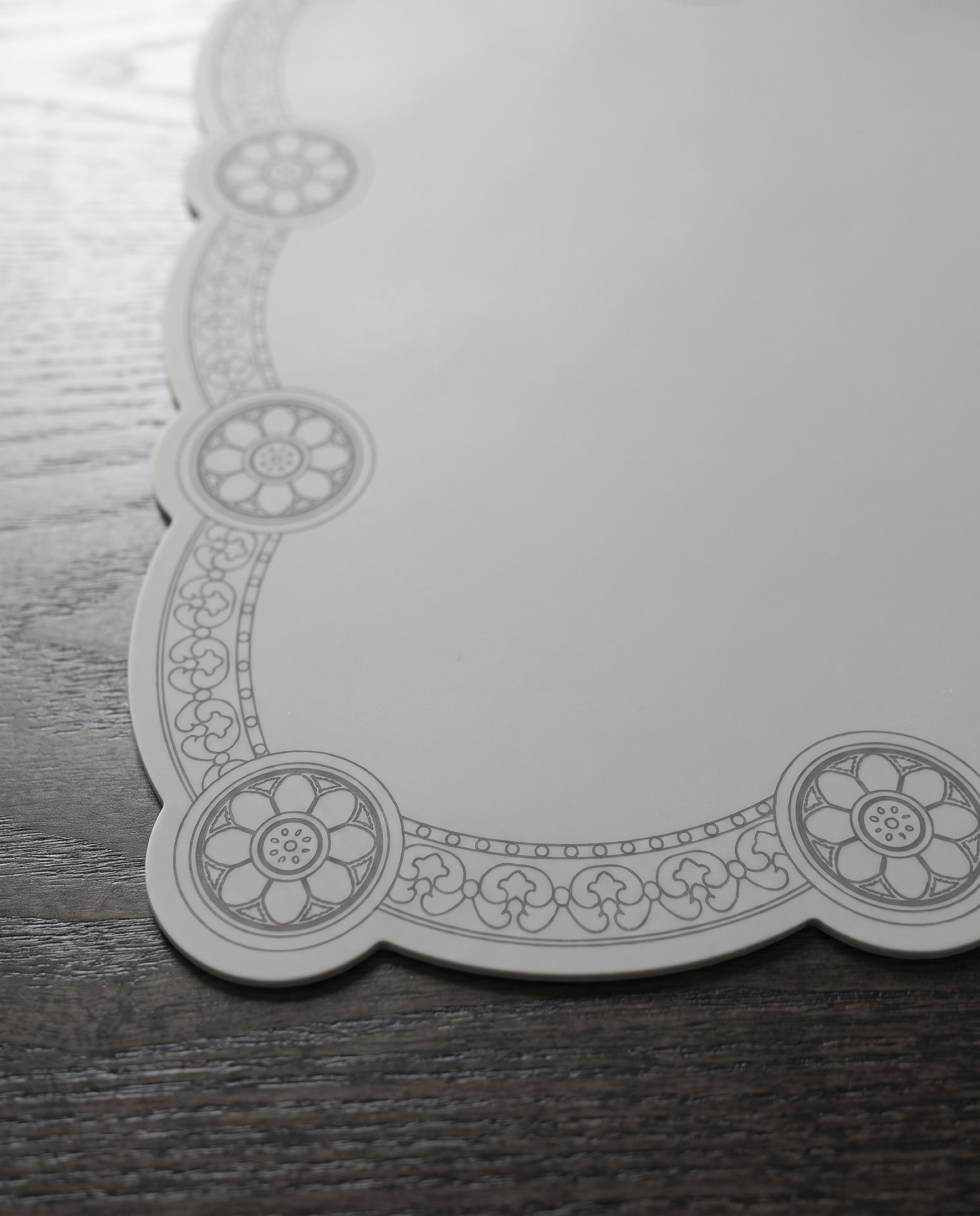 Roof tile silicone table mat by Mimidar, the sumaksae medallion and vine border