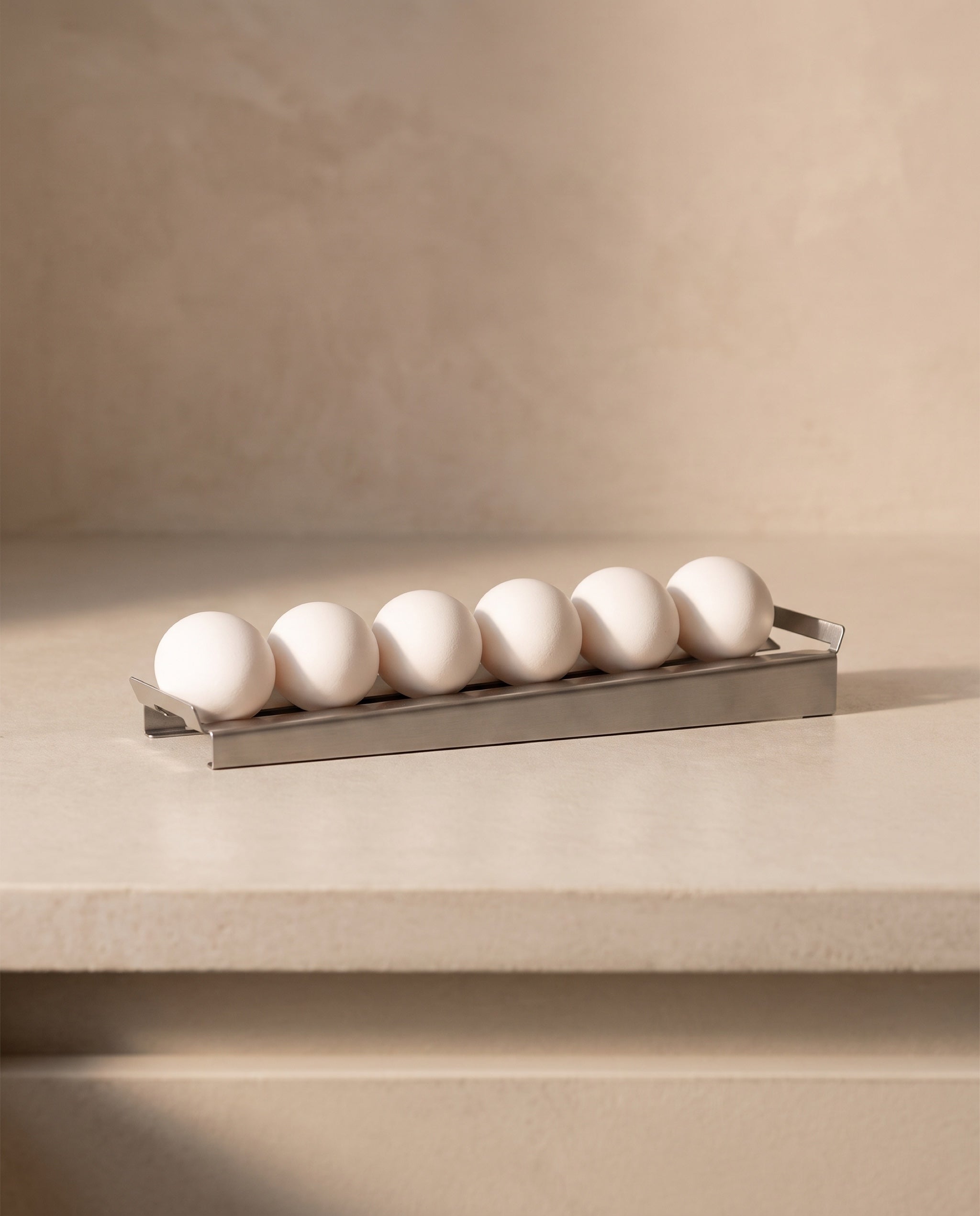 Slope egg tray by TactileEveryday, side elevation showing the incline