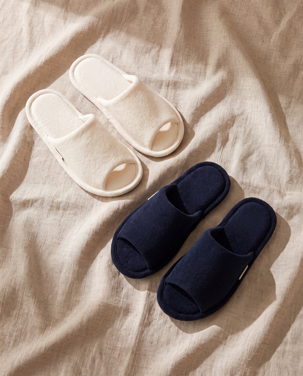 Terry slippers, open type by 1401HOME, cream and navy pairs on beige linen